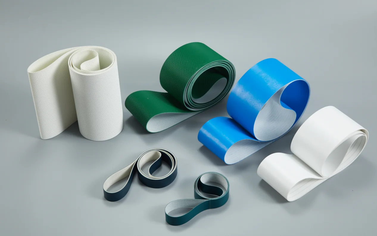 Assorted blue, green, white, and dark industrial conveyor belts