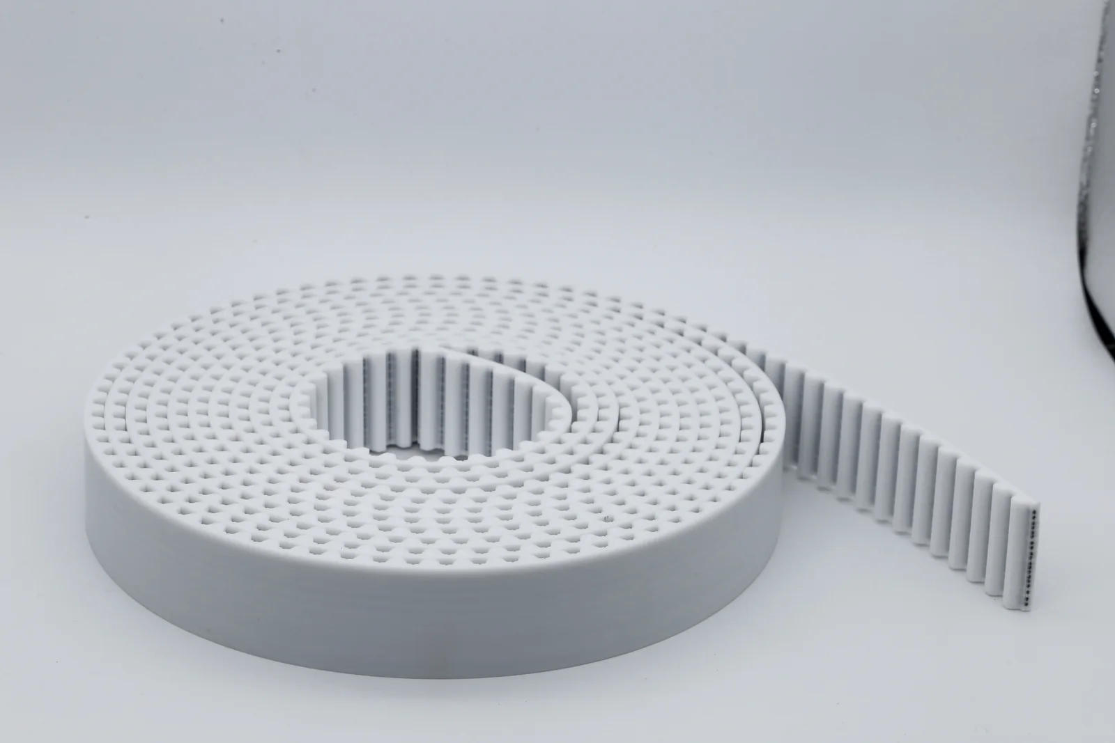 White polyurethane timing belt with visible tensile cords