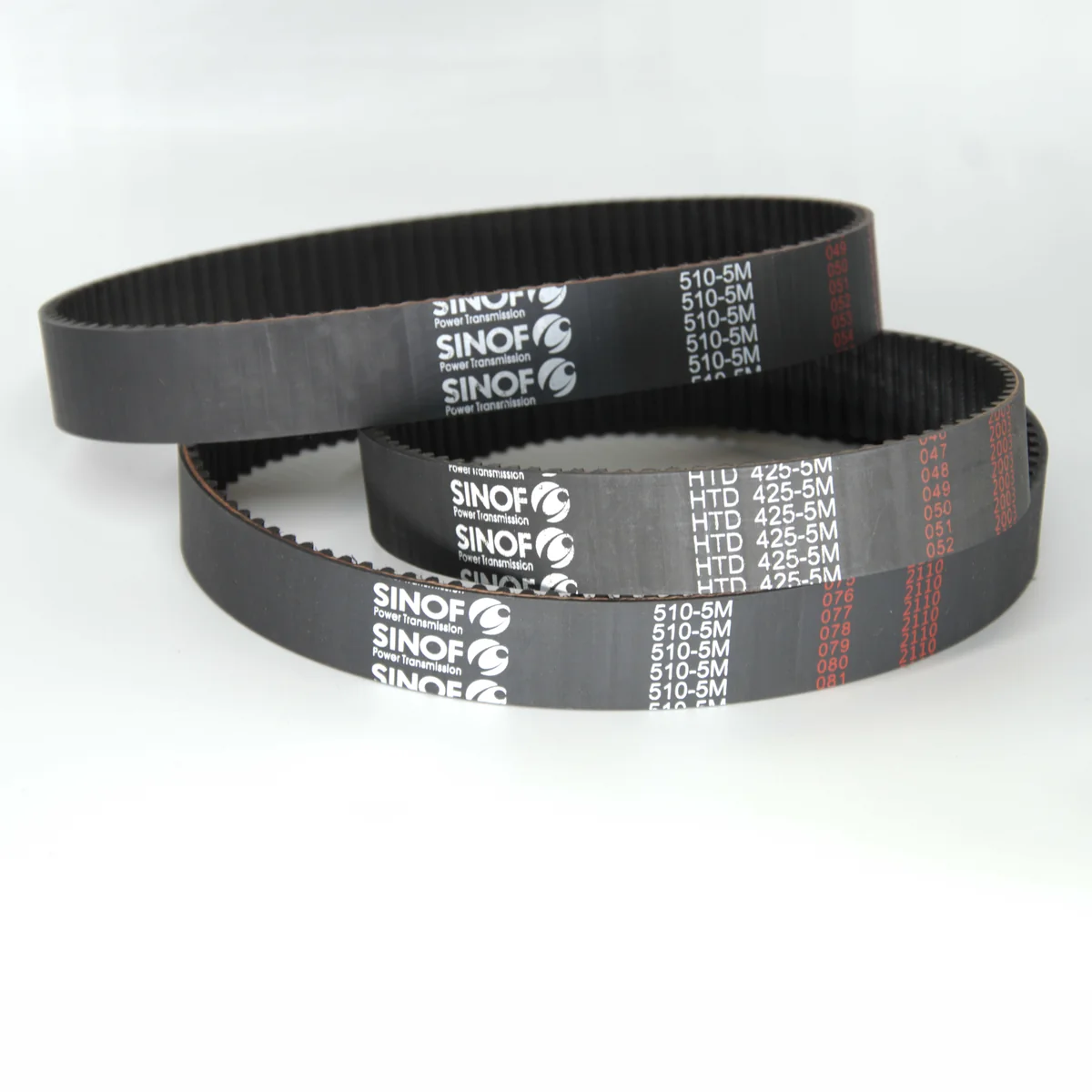 SINOF rubber timing belts on a white background